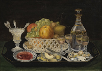 Table with fruit basket and dessert