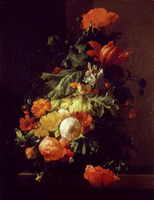 A vase of flowers on a stone slab
