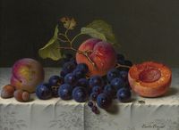 Still life with peaches, grapes and nuts on a table