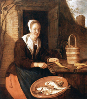 A Woman Cleaning Carrots